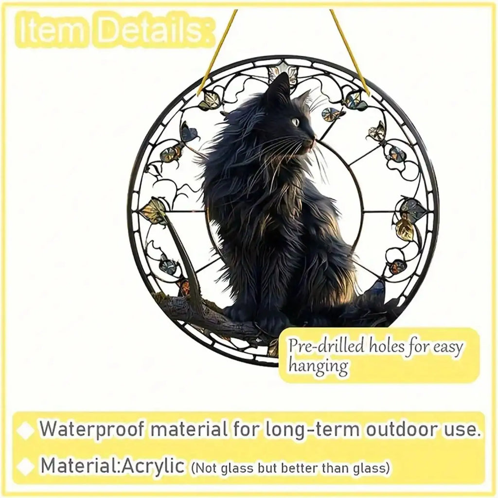Black cat pendant sitting on a tree branch basking in the sun