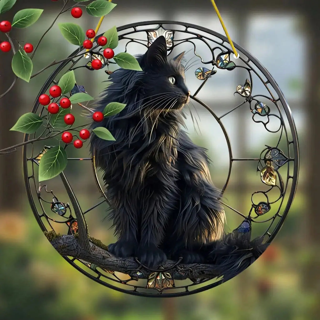 Black cat pendant sitting on a tree branch basking in the sun